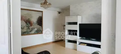 Charming living room with elegant decor and modern entertainment setup.