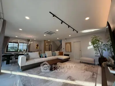 Spacious modern living room with elegant decor and ample natural light