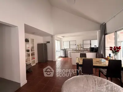 Spacious open-plan kitchen and dining area with modern appliances and natural light.