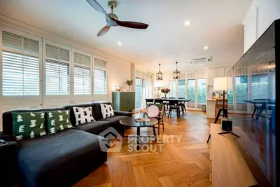 Spacious modern living room with stylish decor and wooden flooring