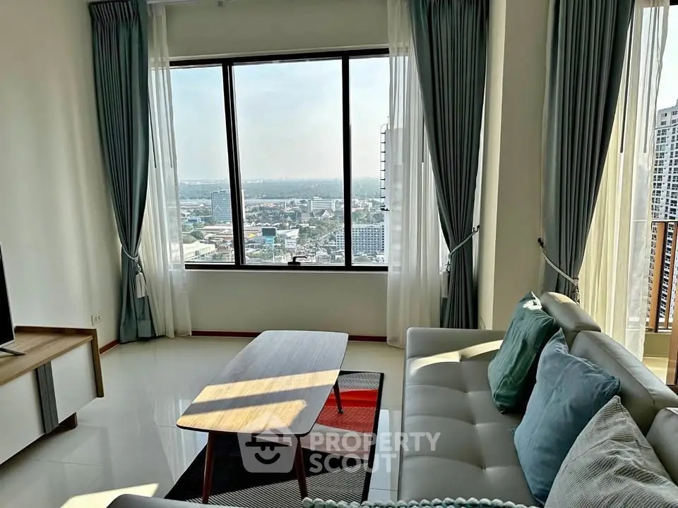 Spacious living room with stunning city view and modern decor