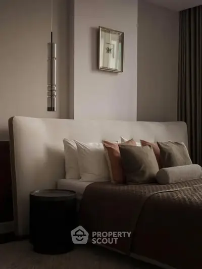Luxurious bedroom with elegant decor and plush bedding, perfect for relaxation and comfort.