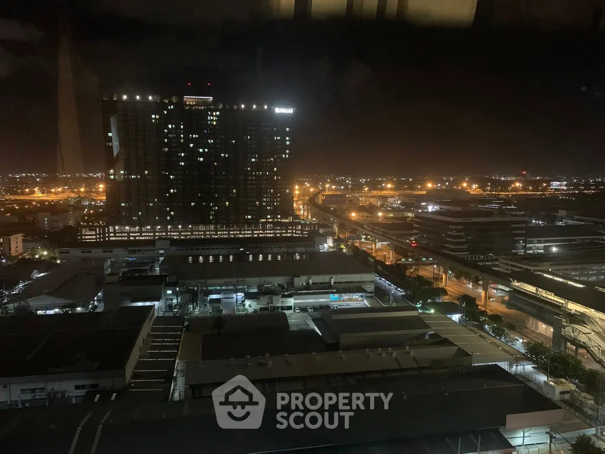 Stunning cityscape night view from high-rise building, showcasing vibrant urban lights and modern architecture.