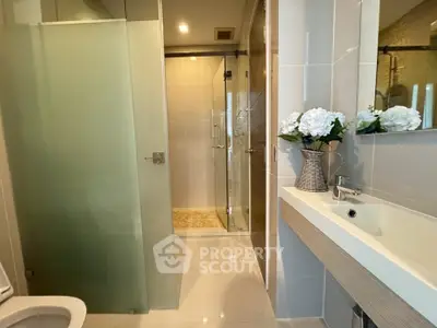 Modern bathroom with glass shower and elegant sink design