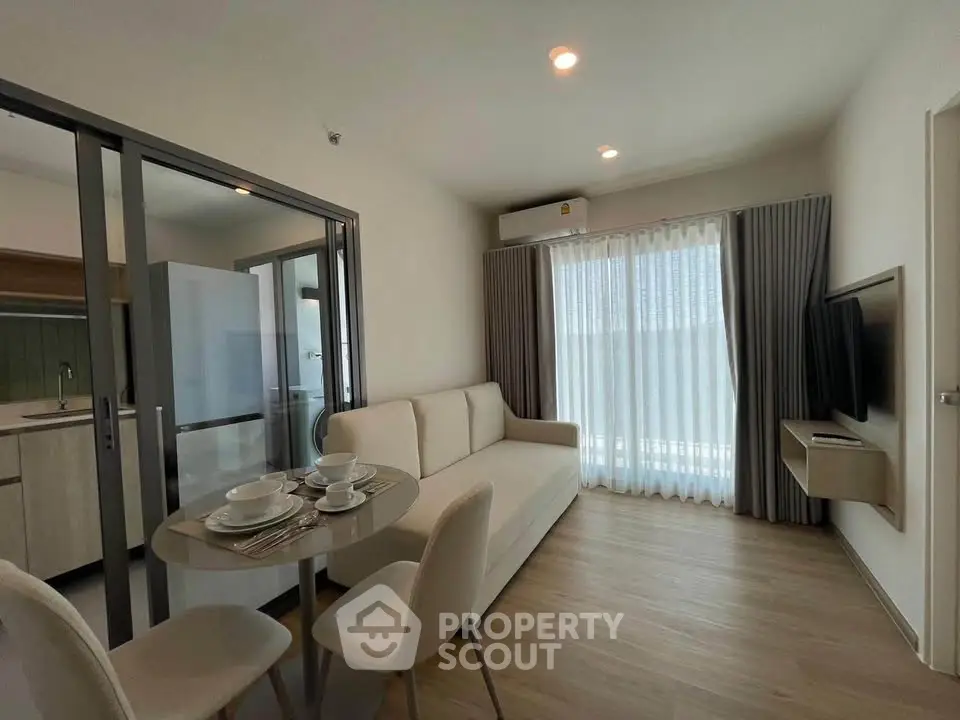 Modern living room with dining area and natural light