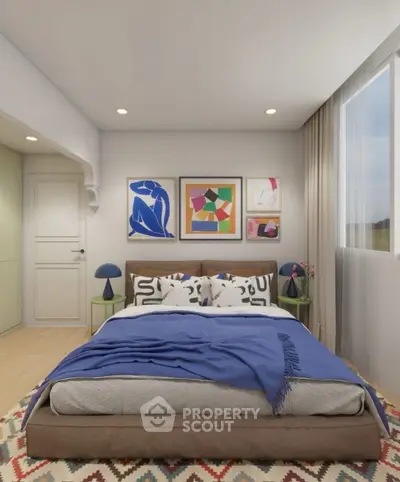 Stylish bedroom with modern decor and large window for natural light.