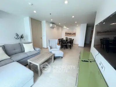 Spacious modern living room with elegant dining area and stylish furniture