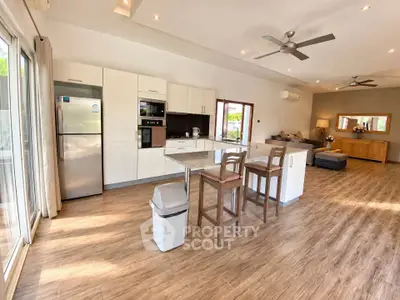 Spacious open-plan kitchen and living area with modern appliances and stylish decor.