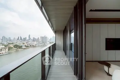 Luxurious high-rise balcony with stunning city and river views, perfect for urban living.