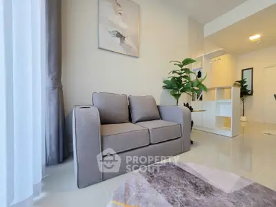 Modern living room with stylish gray sofa and elegant decor