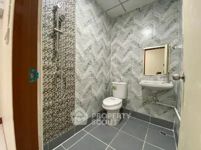 Modern bathroom with stylish tile design and sleek fixtures