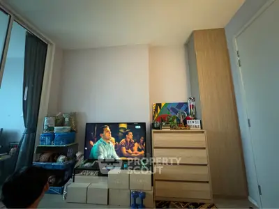 Cozy living room with modern decor and entertainment setup, perfect for relaxation and leisure.