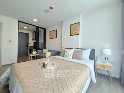 Modern bedroom with stylish decor and cozy ambiance in a contemporary apartment.