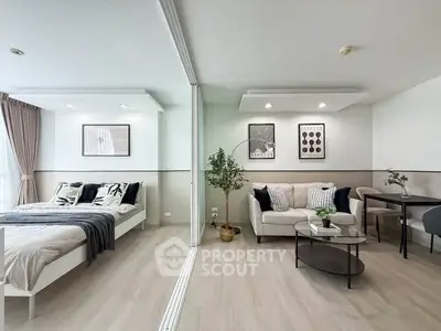 Modern open-plan studio apartment with stylish decor and natural light
