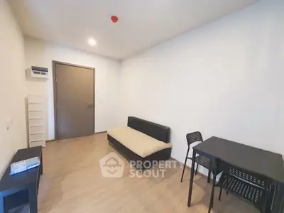 Modern minimalist living room with sleek furniture and wooden flooring