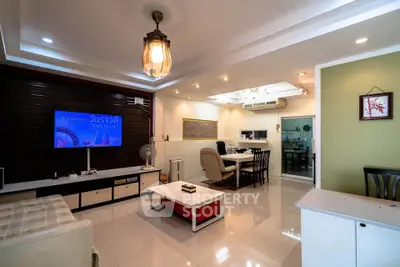 Spacious modern living room with stylish decor and ample natural light