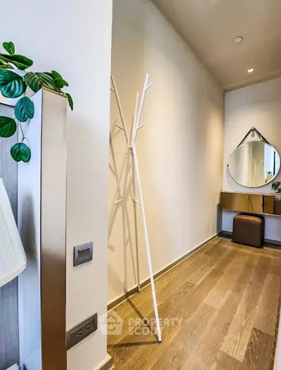 Stylish hallway with modern decor and wooden flooring in a contemporary home.