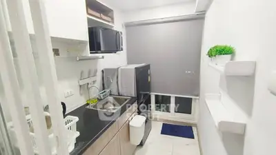 Modern compact kitchen with sleek design and efficient use of space