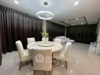 Luxurious modern living room with elegant dining area and stylish lighting
