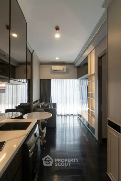 Modern living room with sleek design, featuring built-in shelves and a cozy seating area.