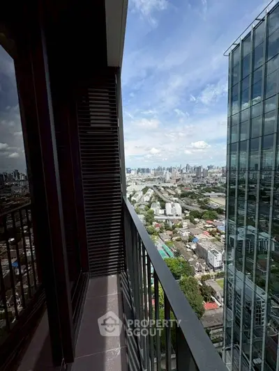 Stunning cityscape view from a high-rise balcony, perfect for urban living enthusiasts.