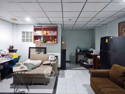 Cozy living room with modern furniture and ample storage space, perfect for relaxation and entertainment.