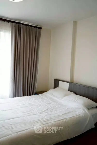 Cozy bedroom with modern decor and natural light