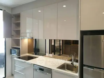 Modern kitchen with sleek cabinetry and stainless steel appliances