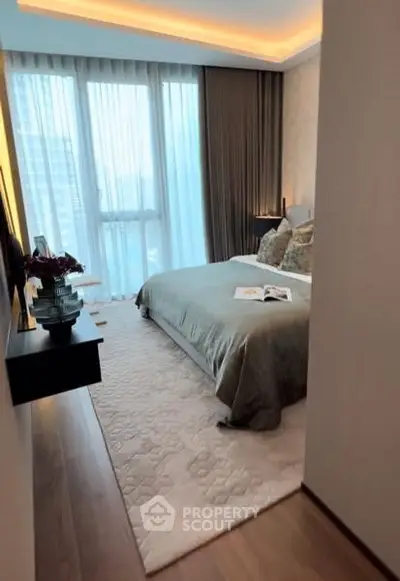 Luxurious bedroom with floor-to-ceiling windows and elegant decor