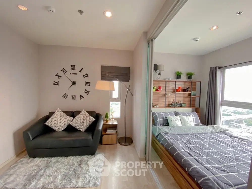 Modern studio apartment with cozy living area and stylish bedroom