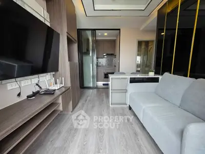 Modern living room with sleek design and open kitchen layout