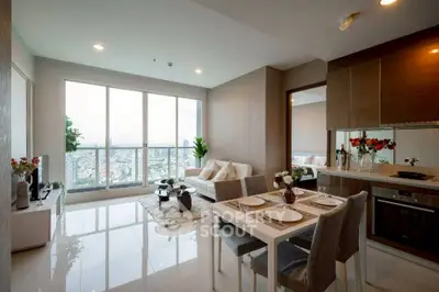 Modern open-layout living room with dining area and stunning city view.