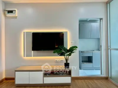 Modern living room with sleek TV unit and ambient lighting