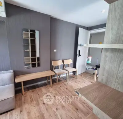 Modern living room with wooden flooring and minimalist furniture