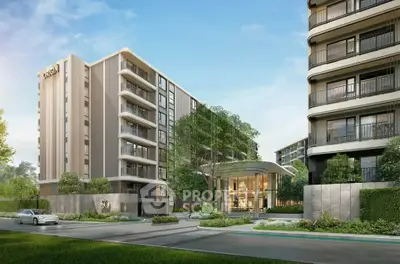 Modern residential building with lush greenery and sleek architecture in urban setting.