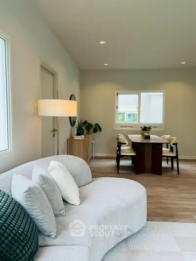 Modern living room with stylish furniture and natural light