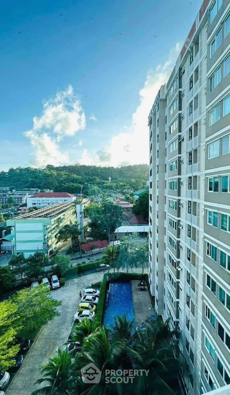Stunning high-rise building with pool and scenic view, perfect for urban living.