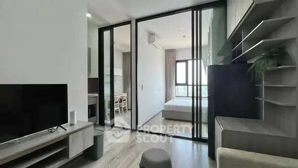 Modern apartment interior with sliding glass doors and stylish furnishings