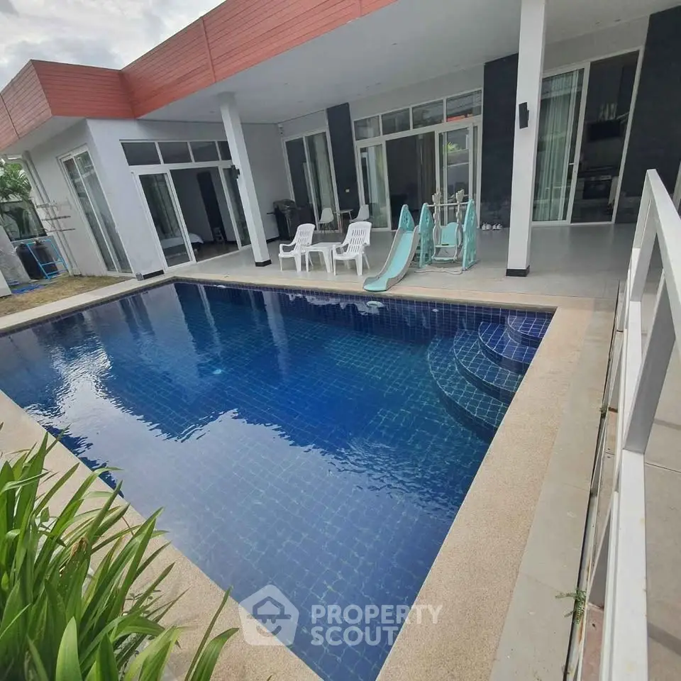 Luxurious modern villa with private pool and spacious patio, perfect for relaxation and entertainment.