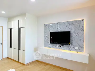 Modern living room with stylish TV wall and sleek storage cabinets, perfect for contemporary living.