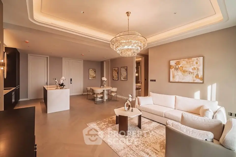 Luxurious living room with elegant chandelier and modern decor in upscale apartment