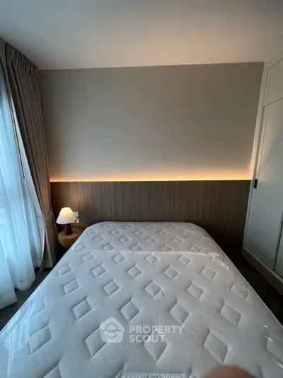 Modern bedroom with stylish lighting and cozy ambiance