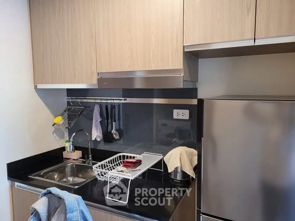 Modern kitchen with sleek cabinets and stainless steel appliances