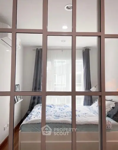 Modern bedroom with large window and stylish decor