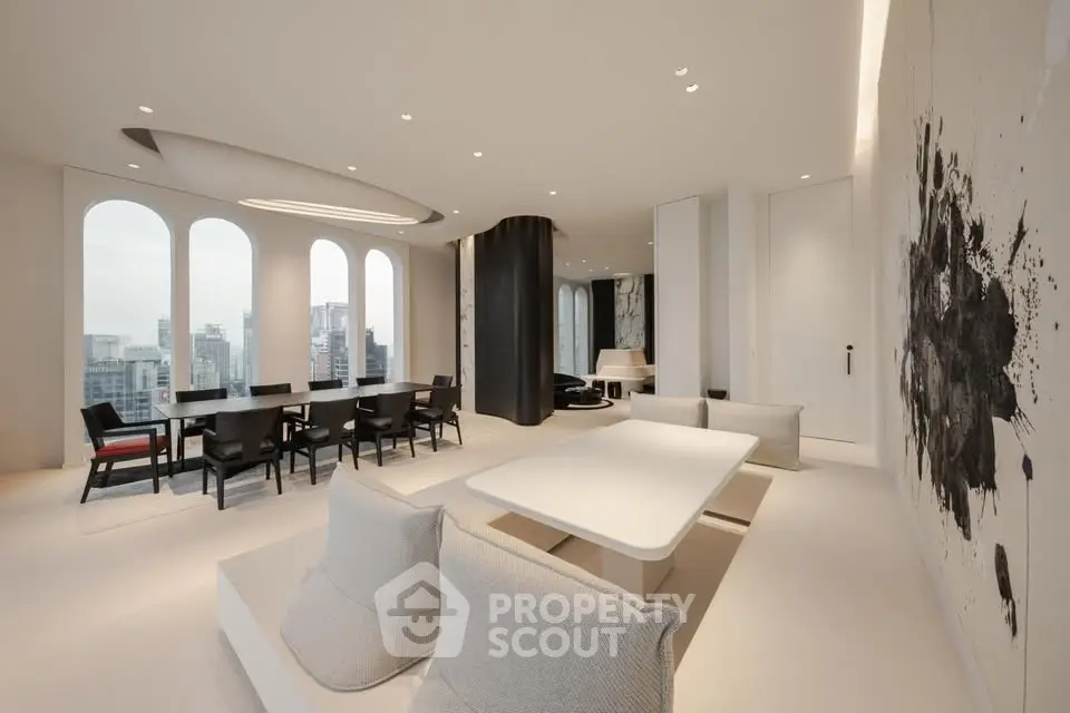 Luxurious modern living room with elegant dining area and city view.