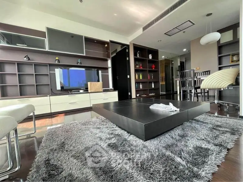 Luxurious modern living room with sleek furniture and stylish decor in a high-end apartment.