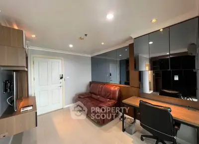 Modern living room with leather sofa and mirrored wall in stylish apartment