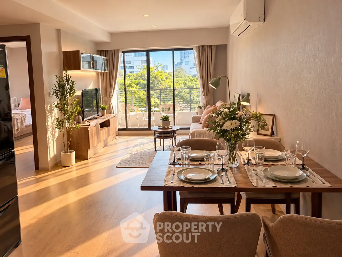 Spacious living room with dining area and large windows offering a bright, airy ambiance in modern apartment.