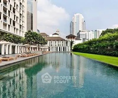 Luxurious urban poolside with cityscape view and lush greenery