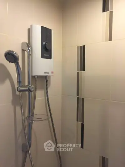 Modern bathroom shower with sleek design and water heater installation.